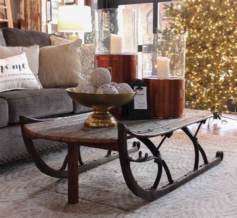 A Living Room Filled With Furniture And A Christmas Tree In The Backgroung