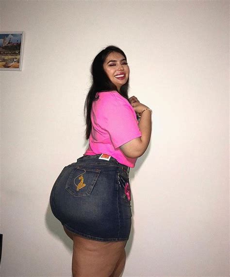 Beautiful Curvy Woman In Pink Shirt And Jean Skirt