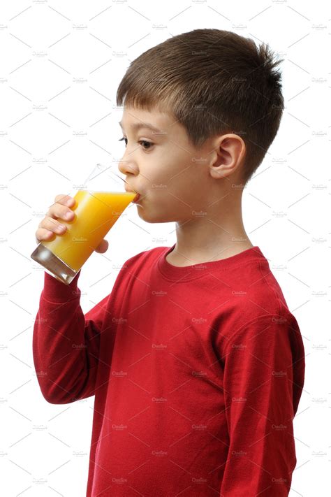 Child Drinks Orange Juice People Images ~ Creative Market