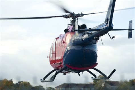Free Image Of Red Helicopter Hovering Freebiephotography