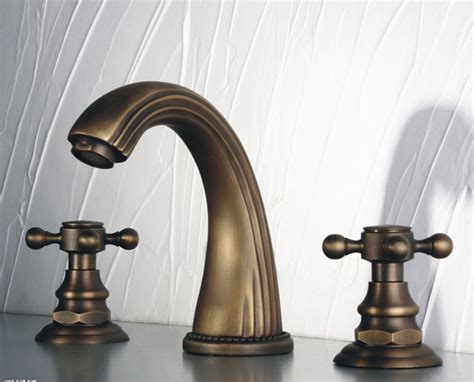 Brass is a versatile material that coordinates with any sink top color, including black, white, and marble. Antique Brass Widespread Bathroom Faucet With Cross ...
