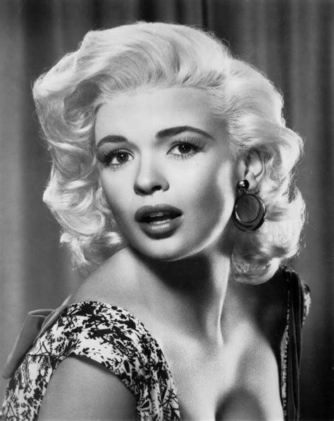 Marilyn Monroe In An Old Black And White Photo With Large Hoop Earrings On Her Head