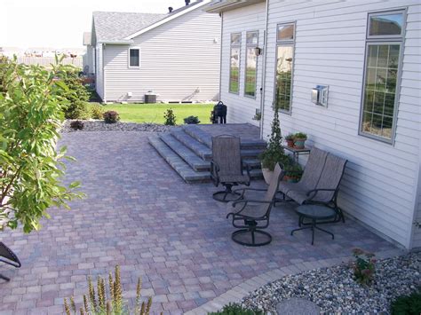 The lush patio surrounding this colorful key west, florida, home features iconic old chicago brick, or pavers reclaimed from buildings demolished in the windy city. Multi-Colored Paver Patio with Stair System and Rock Fill ...