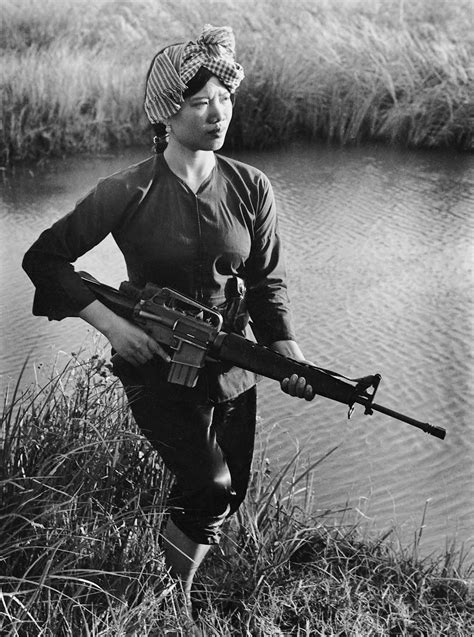 Female Vietcong Guerilla Fighter Carrying A M Rifle During The Vietnam War In