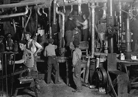 Black And White Photograph Of People Working In A Factory