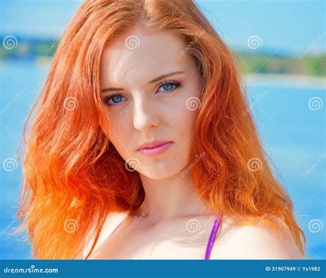 Beautiful Girl With Red Hair And Bikini Posing On A Beach Stock Image