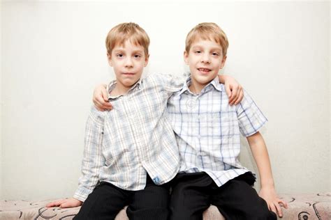 Two Twins Brothers Hugging And Smiling Stock Image Image 29110923