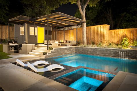 Before entering the small house, the swimming pool deck morphs into a covered outdoor dining/entertaining area, with a custom built bbq / outdoor kitchen, enough space for a dining table, and a bar area with a window that opens to the kitchen. Pool Environments, Plano, TX | Pool houses, Pool house ...