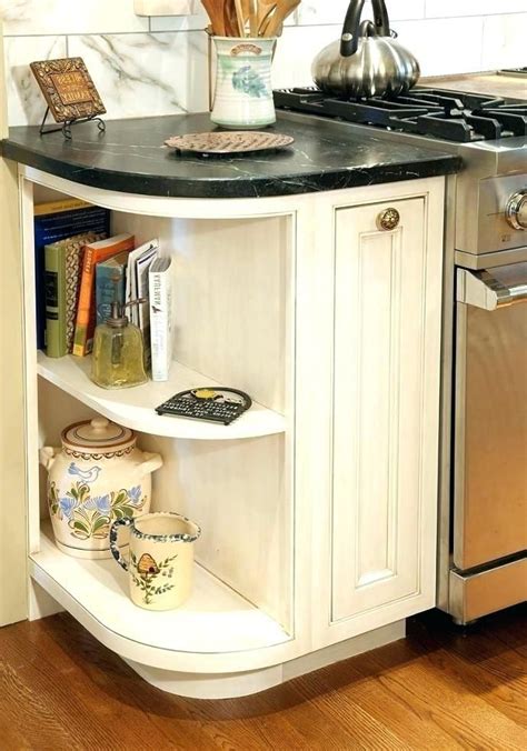 A corner bathroom cabinet is a clever space saving bathroom furniture design. cabinets with curved corner cabinet - Possibility for end ...