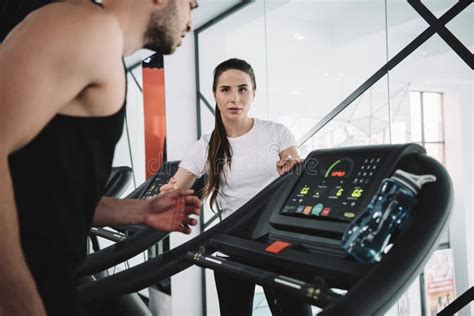 Attentive Trainer Looking At Sportsman Running Stock Image Image Of