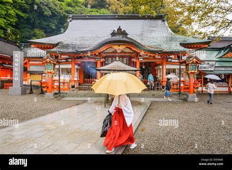 A Shinto Priest And Tourists At Kumano Nachi Taisha Shrines Heiden