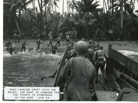 Soldiers Disembark From An Lcvp Onto The Beach During Amphibious
