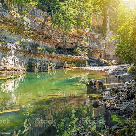 Waterhole From Rock Erosion In Riverbed In Middle Of Forest Stock Photo