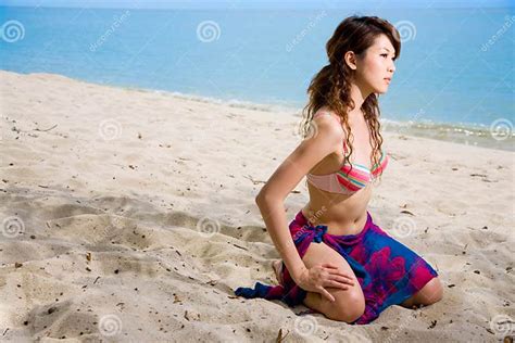 woman kneeling on the beach stock image image of summer woman 4684201