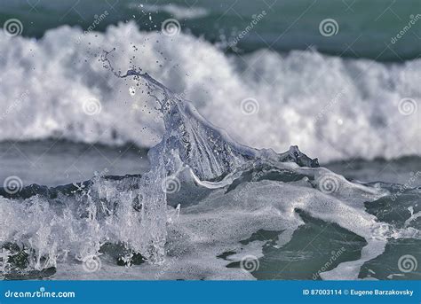 Water Splash On Seaocean Wave Crest Against Blurred Backg Stock Photo