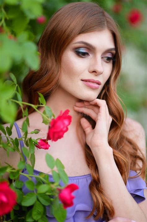 Portrait Of Beautiful Young Woman Posing With Roses Stock Photo Image
