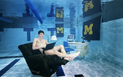 michael phelps poses at bottom of university of michigan pool in 2005 sports illustrated