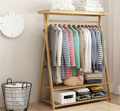 14 Clothes Racks That Store Your Garments In Style Wood Clothing Rack