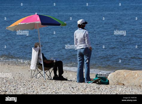 Couple Beach Umbrella Older Hi Res Stock Photography And Images Alamy
