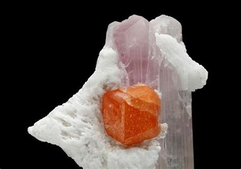 A Well Formed Orange Crystal Of Spessartine Measuring To 14cm Sits At