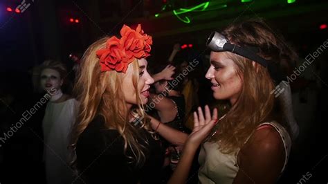 Sexy Lesbian Kiss At Halloween Party In Nightclub Flower Rim Aviator Costume Stock Video