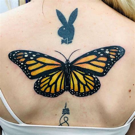 Butterfly Tattoo On Upper Back