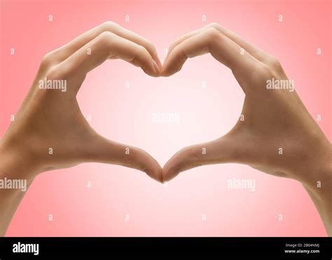 Female Hands Form Heart Shape Gesture Isolated On Empty Background