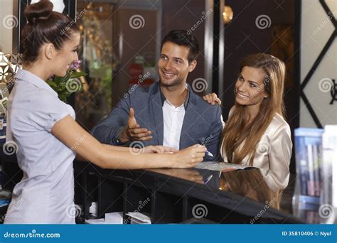 Happy Couple At Hotel Reception Stock Photo Image Of Goodlooking