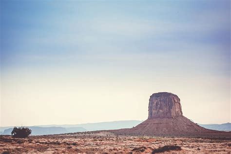 Hazy Sunset Over Mitchell Butte Monument Valley Photograph By Mati