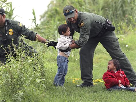 Dramatic Photos Show Migrant Boy Being Saved From Drowning By Border