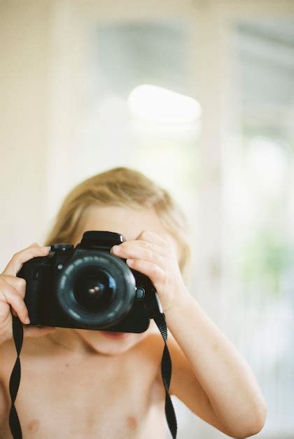 Premium Photo Young Nude Girl Taking A Picture With A Camera