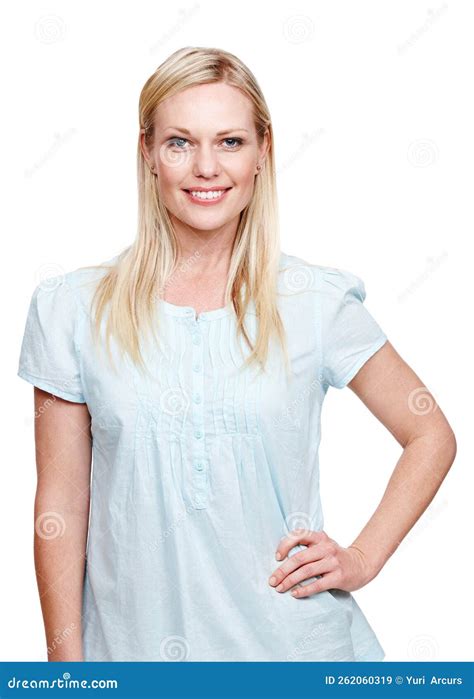 Candidly Casual A Beautiful Blonde Woman Standing With Her Hand On Her Hip And Smiling At The
