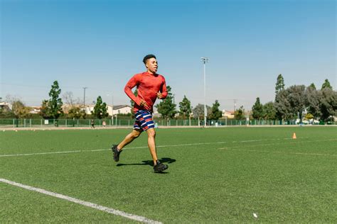 Man Jogs On The Soccer Field · Free Stock Photo