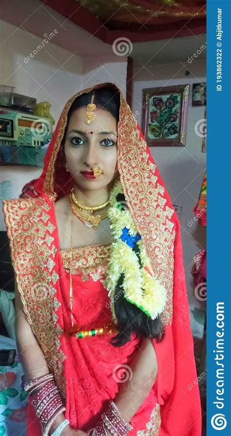 A Beautiful Newly Married Girl Is Sitting In Sari And Ornamants