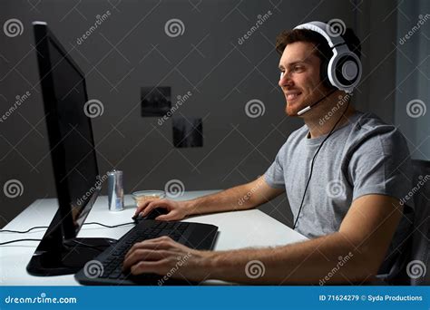 Man In Headset Playing Computer Video Game At Home Stock Image Image