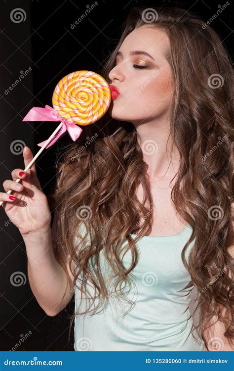 Pretty Girl Eats A Candy Sweet Lollipop Candy Stock Photo Image Of