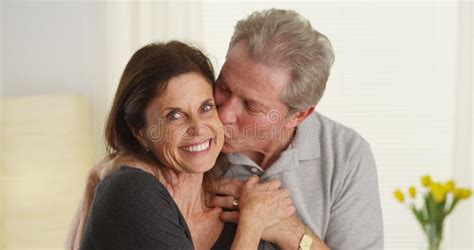 Cute Senior Couple Kissing And Smiling At Camera Stock Image Image Of Camera Mature 47875983