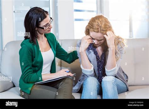 Psychologist Comforting A Depressed Patient Stock Photo Alamy