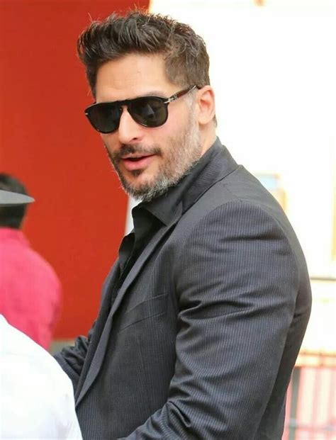 A Man Wearing Sunglasses And A Suit