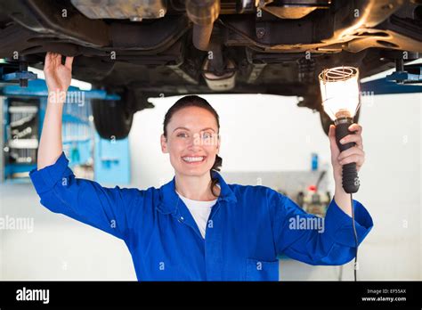 Mechanic Shining Torch Under Car Stock Photo Alamy