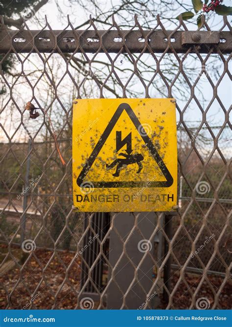 Danger Of Death Yellow Rusty Dirty Unclean Sign On Metal Fence L Stock