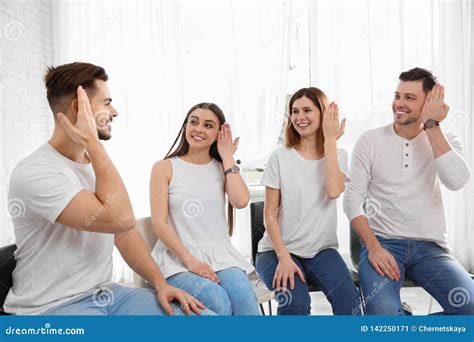 Group Of Young People Learning Sign Language With Teacher Stock Image