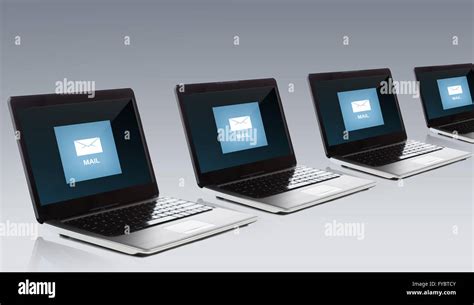 Laptop Computers With Email Message Icon On Screen Stock Photo Alamy