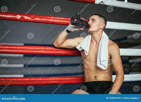 Male Boxer Drinking Water After Fight Or Workout Exercising Stock Image