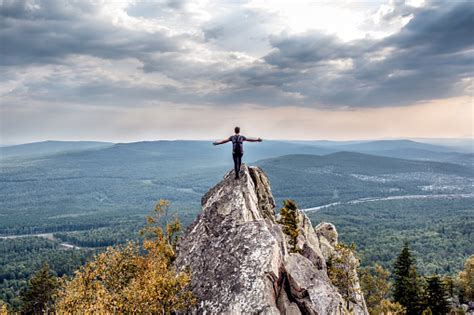 A Young Man On A Mountain Peak Stock Photo Download Image Now Istock