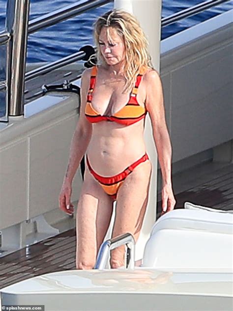 Melanie Griffith Shows Off Her Toned Bod As She Takes A Dip Off A Yacht In