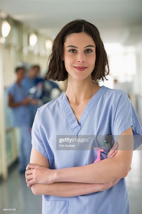 Portrait Of A Female Nurse Standing With Her Arms Crossed High Res