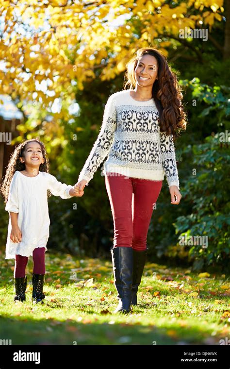 Ethnic Mother And Daughter Walking Outdoors Stock Photo Alamy