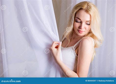 beautiful slender blond girl posing on bed stock image image of adult blond 88444307