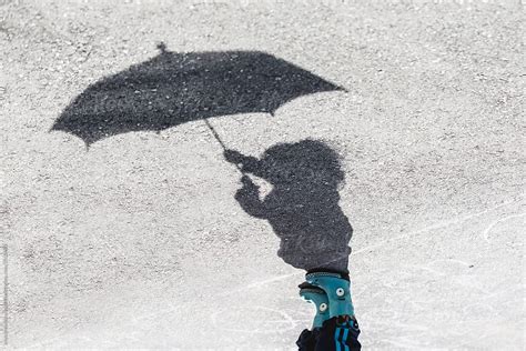 shadow of a girl with an umbrella by stocksy contributor anya brewley schultheiss stocksy